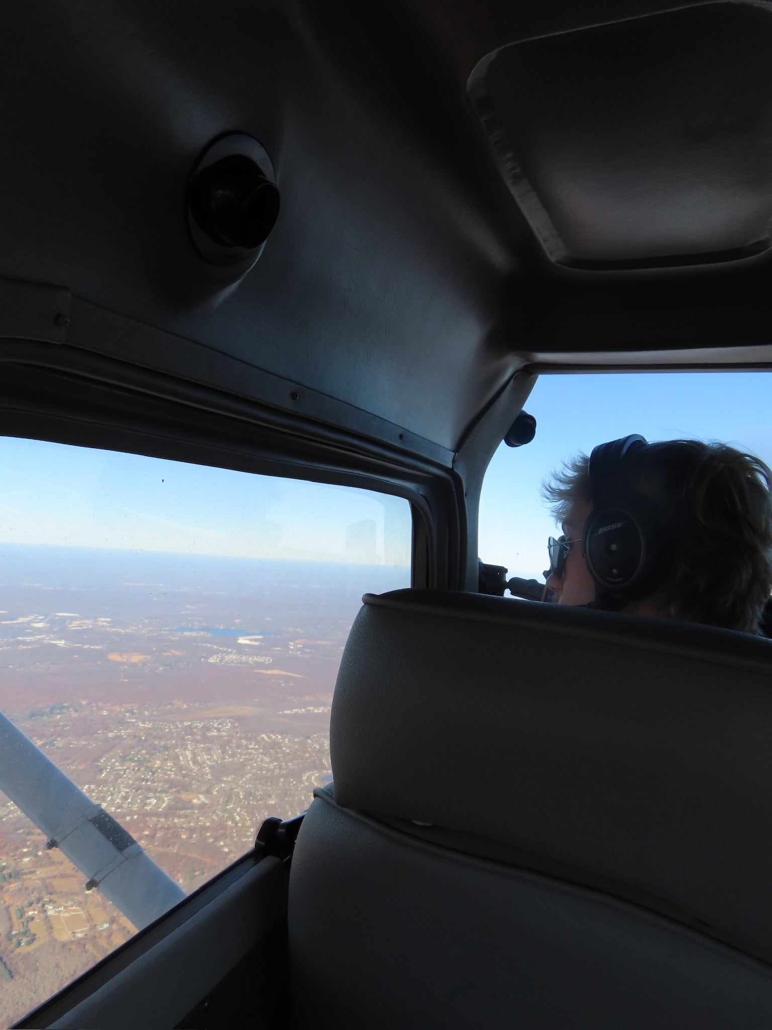 Pilot flying with view of landscape